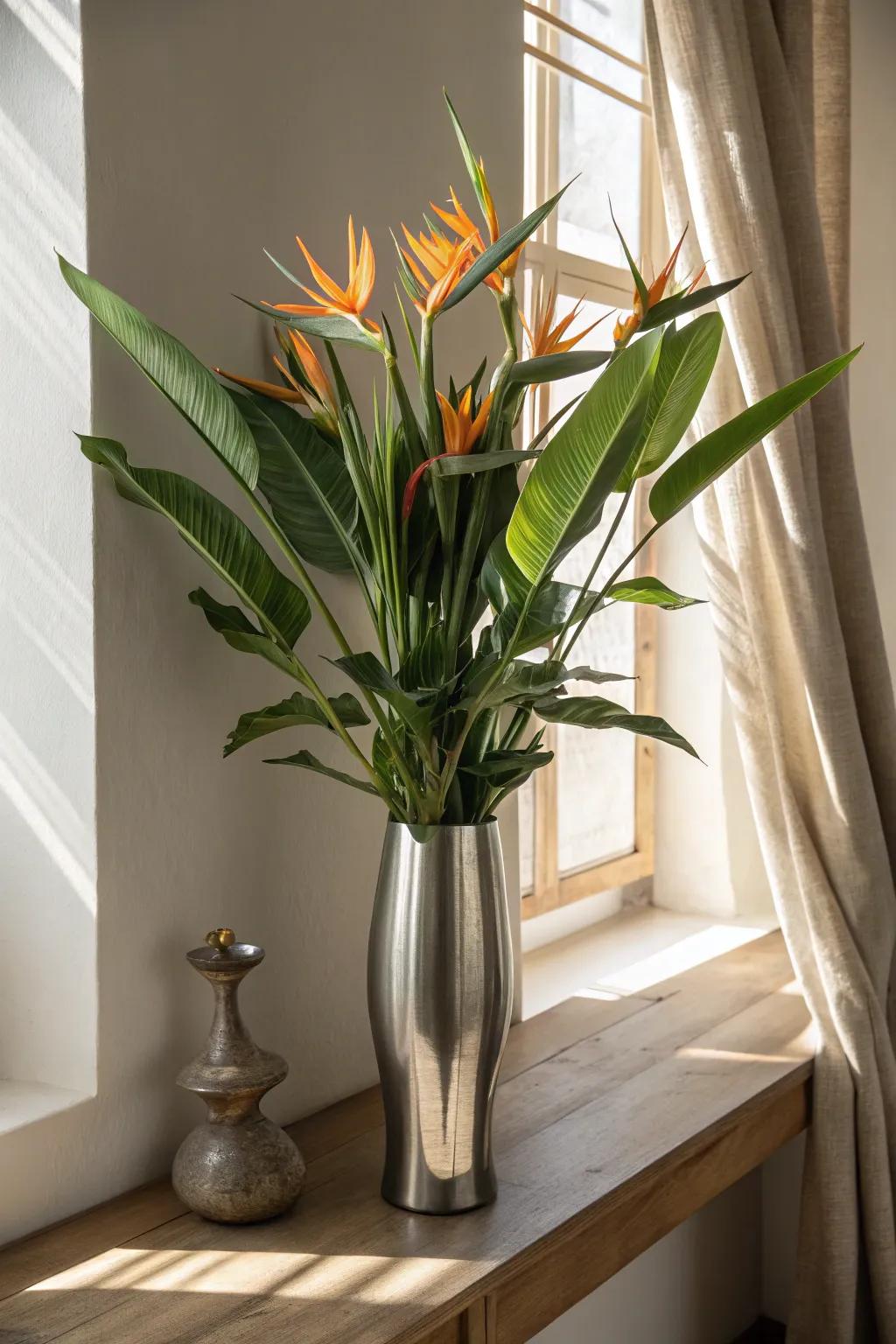 Combine modern elegance with tropical flair using metallic vases for your Bird of Paradise.